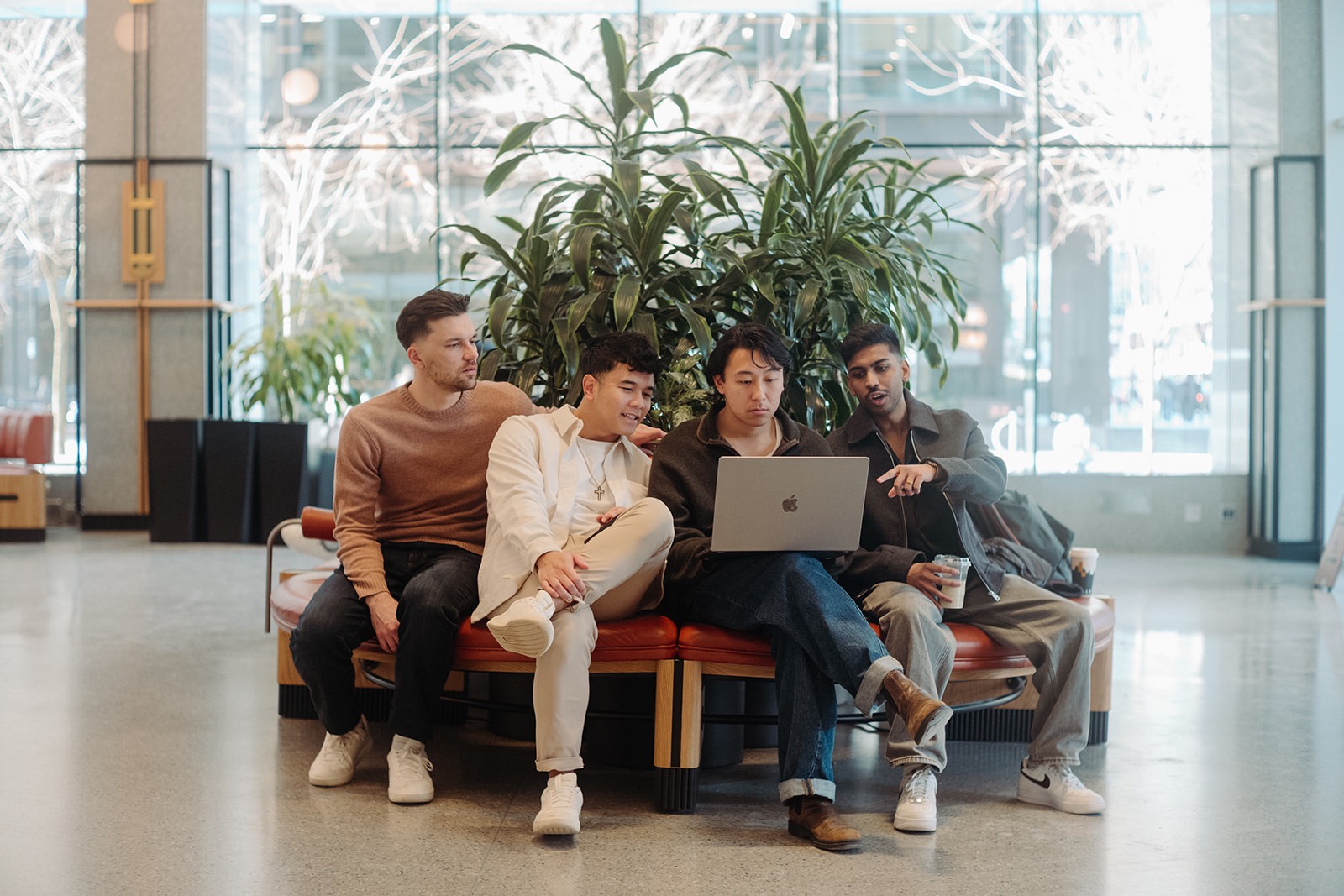 hyperlocal’s four founders, Stephen Joel, Joel Vandervalk, Valiant Chan and Hadi Ekaputra, in a downtown Vancouver lobby